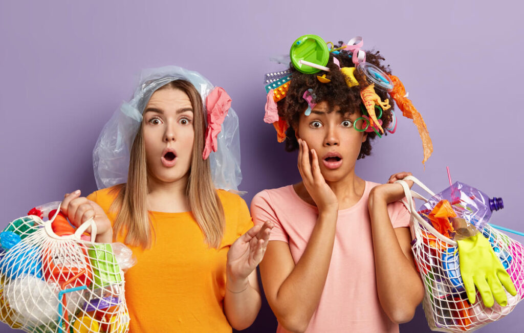 women holding plastic wastes that they use in their daily life.