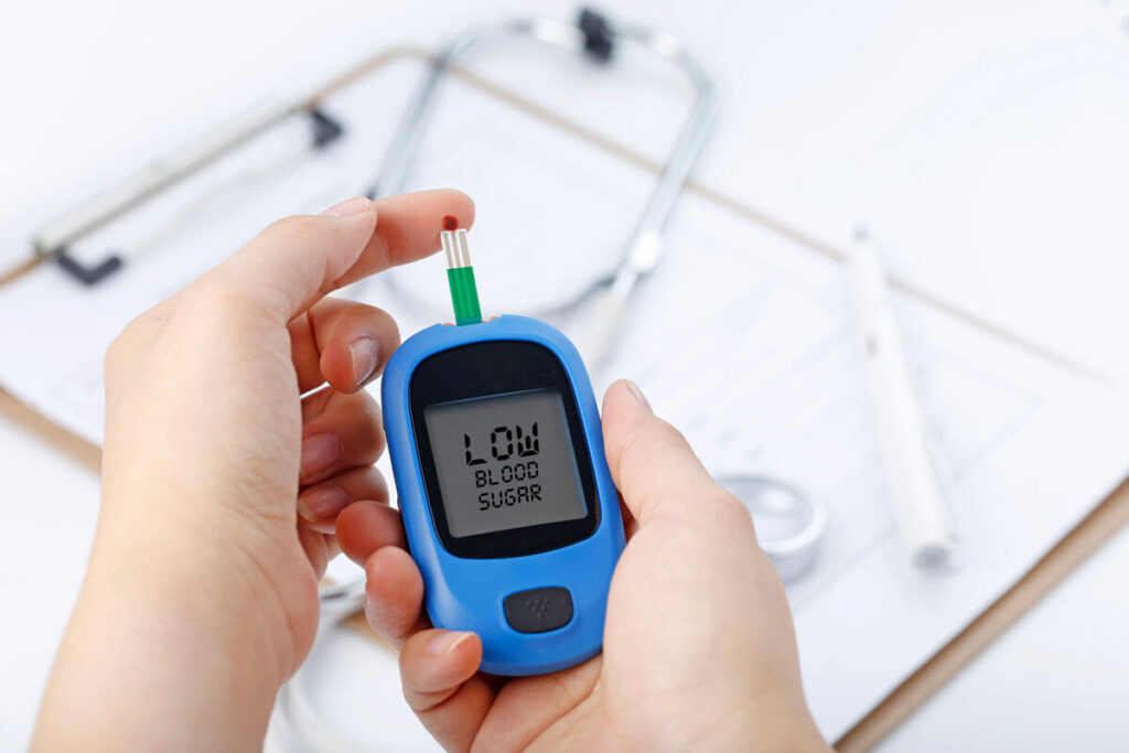 image of a person measuring blood sugar