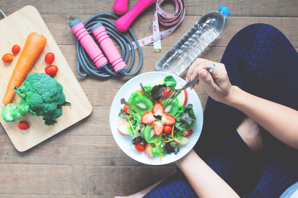 image showing girl eating organic food to maintain her health