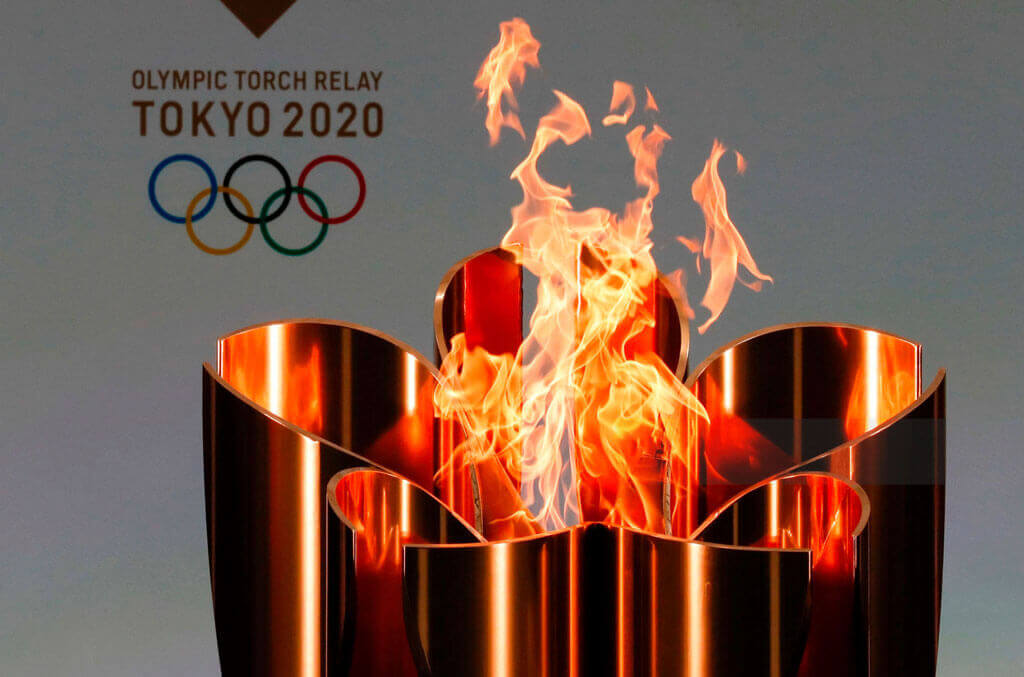 image showing the tokyo olympics 2020 using aluminium torch for tournament