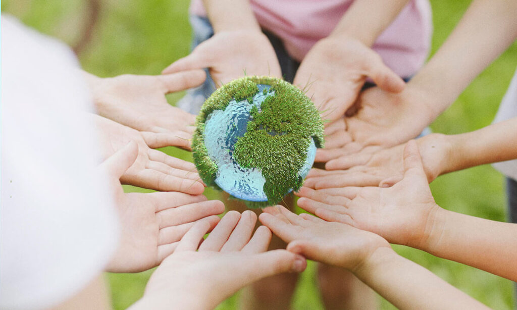 image showing hands with a miniature earth